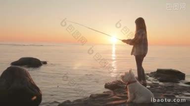 一个小女孩在海边用鱼竿钓鱼，一只小狗坐在旁边